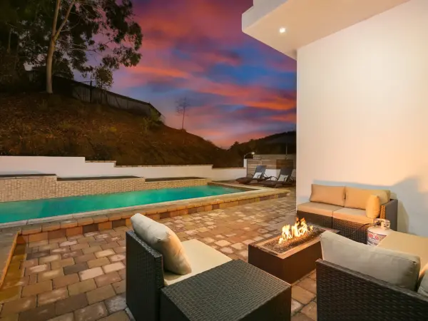 Golden hour at Hill House — poolside shoot, firepit lounge, and epic views.