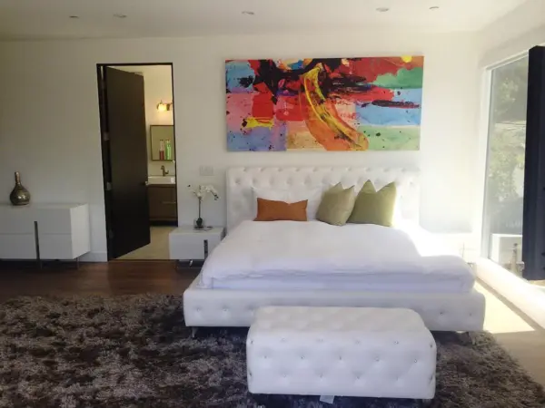 Private creator room with hillside views and custom design touches.