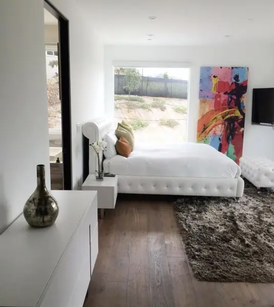 Private creator room with hillside views and custom design touches.
